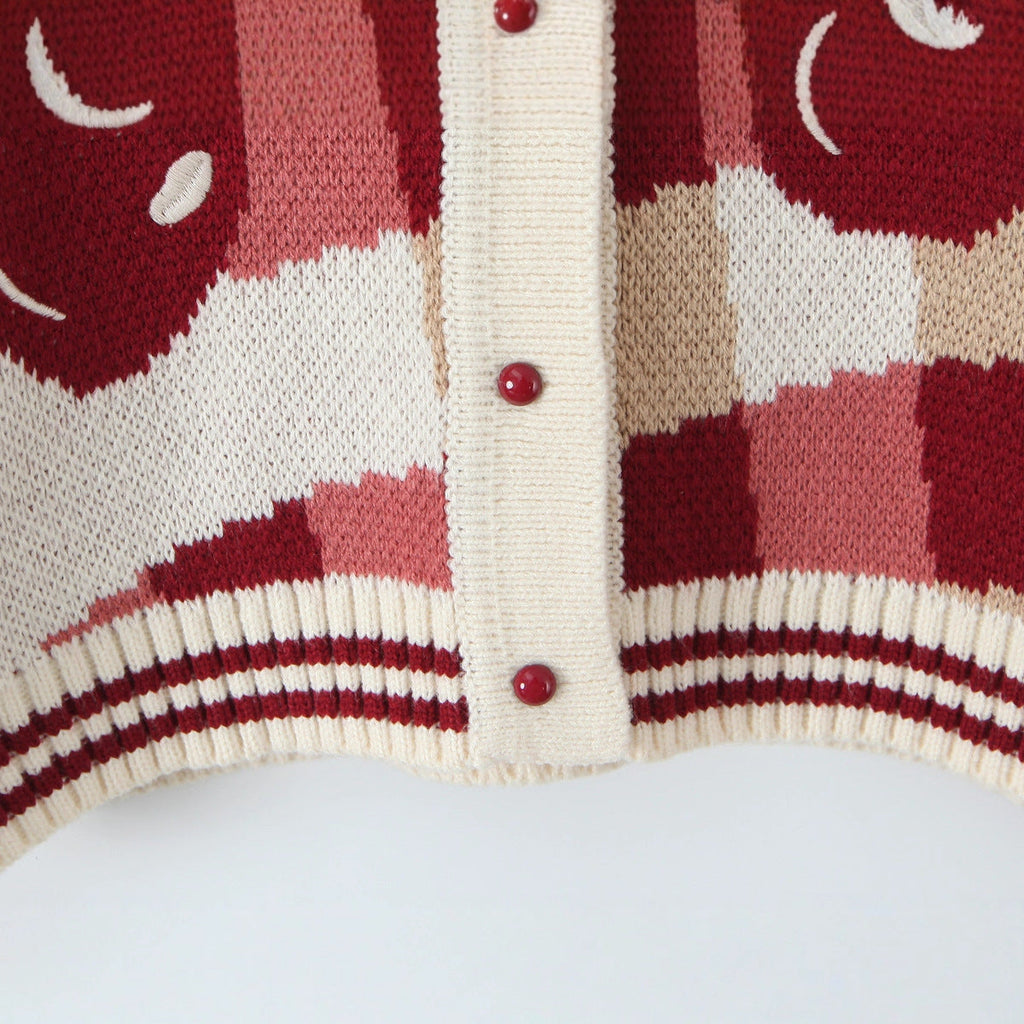 Fröhliche Cropped Strickjacke mit Kirschblütenmuster